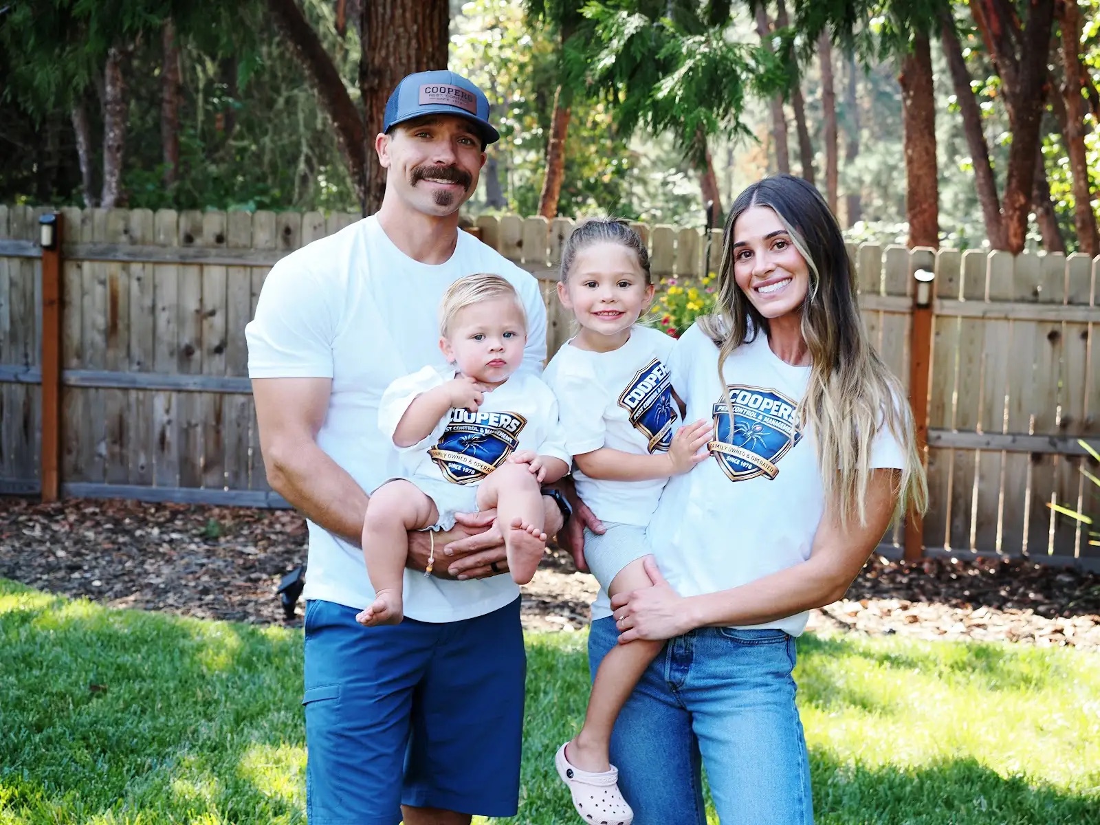 Cooper's Pest Control family standing together outdoors